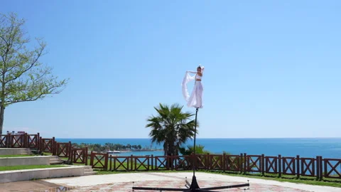 Circus performer on a swaying pole Stock Footage 306449422