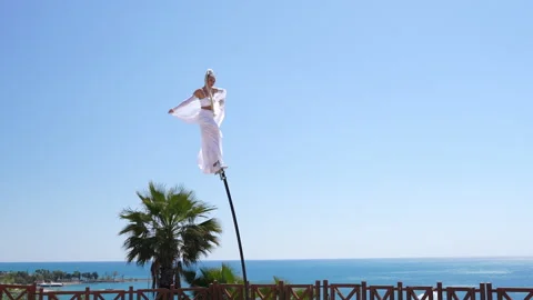 Circus performer on a swaying pole Stock Footage 306449836