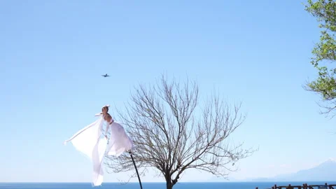 Circus performer on a swaying pole Stock Footage 306450048