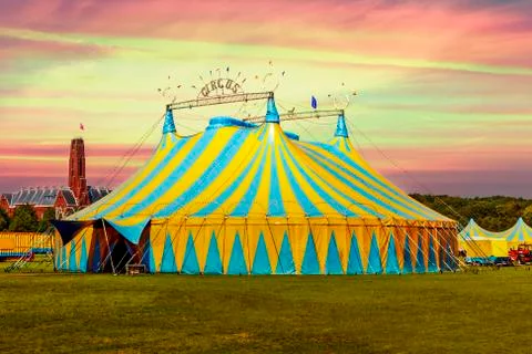 Circus tent under a warn sunset and chaotic sky Stock Photos