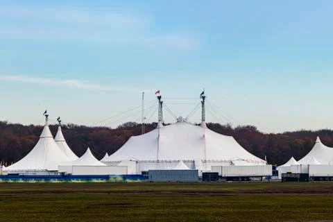 Circus tent under a warn sunset and chaotic sky Stock Photos