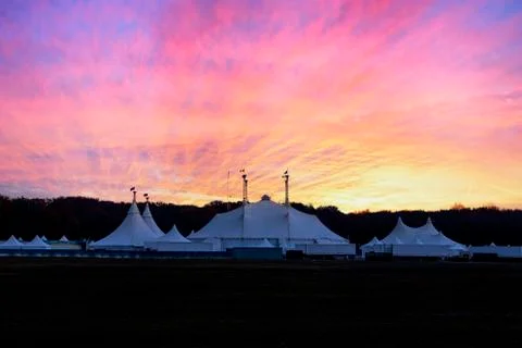Circus tent under a warn sunset and chaotic sky without the name of the circu 库存照片