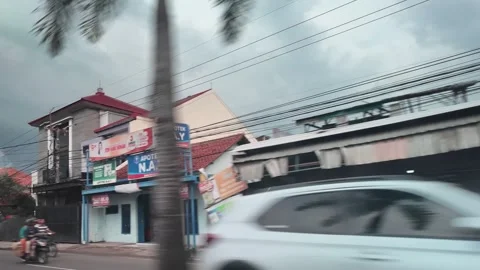 CIREBON, JAVA, INDONESIA - MARCH 5, 2026: car ride through busy City Stock Footage 337190176