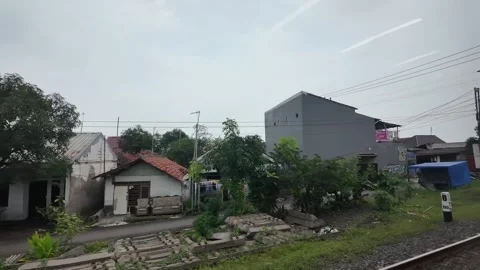 CIREBON, JAVA, INDONESIA - MARCH 6, 2026: Train ride through landscapes on .. 스톡 동영상 337190534