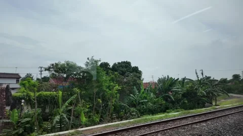 CIREBON, JAVA, INDONESIA - MARCH 6, 2026: Train ride through landscapes on .. 스톡 동영상 337190603