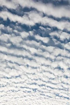Cirrocumulus clouds against blue sky cloudscape background patte Stock Photos