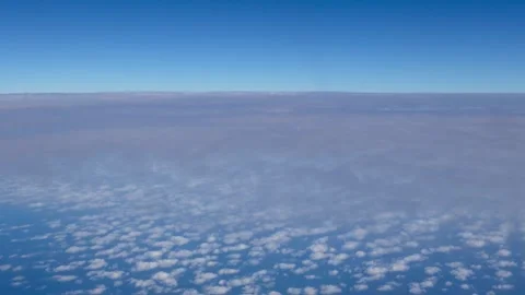 Cirrocumulus clouds and intense blue sky during flight 스톡 동영상 310190878