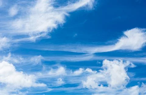 Cirrus and Stratus clouds in dramatic blue sky over Cape Town Stock Photos