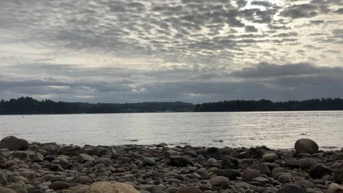 Cirrus Clouds After Sunset on Rocky Island Shore in Puget Sound Stock Footage 249701115