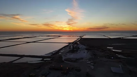 Cirrus clouds and sunrise over salt ponds Stock Footage 340307320