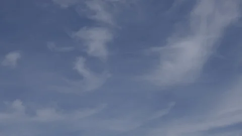 Cirrus Clouds in a blue sky - 4k Time-lapse Stock Footage 106857650