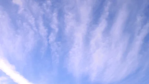 Cirrus clouds on blue sky real time Stock Footage 257455716