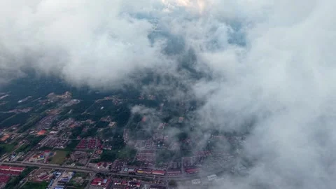 Cirrus clouds drift above urban sprawl Stock Footage 337538100