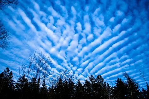 Cirrus clouds forming an unusual grid-like pattern Stock Photos