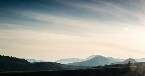 Cirrus clouds move over the mountain range Stock Footage 79399122