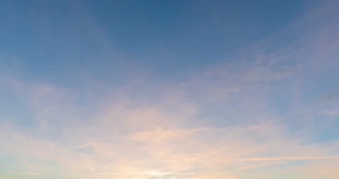 Cirrus clouds movement during sunset. Sky in subtle shades of orange. Stock Footage 211879130