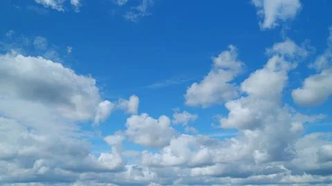 Cirrus with cumulus on different layers clouds flying on beautiful blue sky Stock Photos