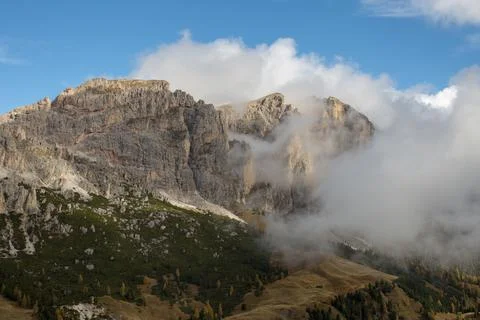 The Cirspitzen, Cime Cir, covered in clouds while the Sky is Blue. The Dolomites Stock Photos