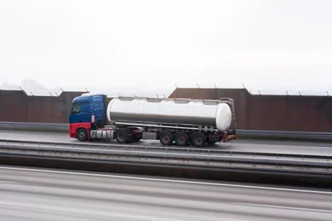 Cistern in motion on a highway. Fast speed tank. Selective focus Stock Photos