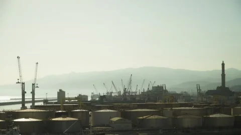 Cisterns, the lighthouse and the mountains of the port of Genoa Stock Footage 314736505