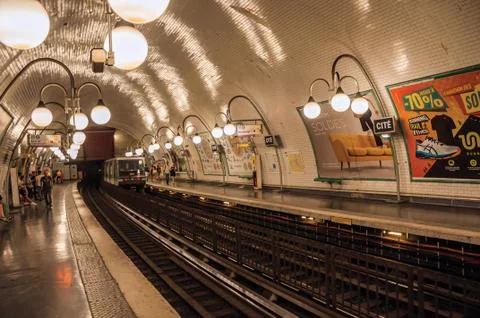 Cite subway station platform with train and luminaires in Paris Stock Photos