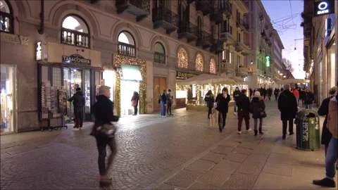 Citizens and tourists stroll down an old town street 스톡 동영상 296493553
