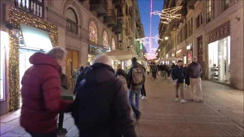 Citizens and tourists stroll down an old town street Stock Footage 296493574