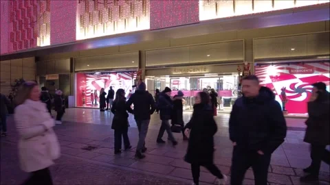 Citizens and tourists stroll down a pedestrian street Stock Footage 296493579