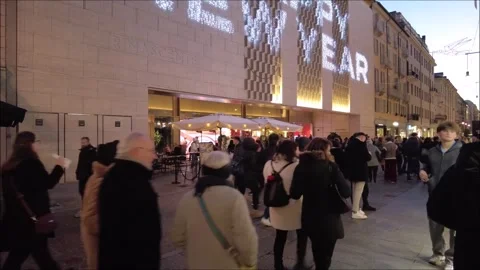 Citizens and tourists stroll down a pedestrian street Stock Footage 296493590