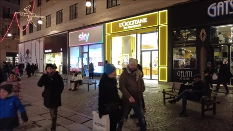 Citizens and tourists stroll down an old town street Stock Footage 296493604