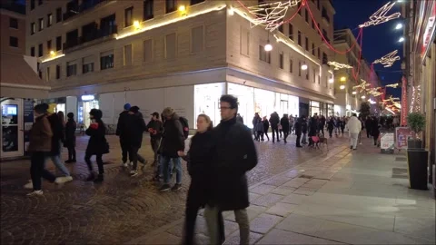 Citizens and tourists stroll down an old town street Stock Footage 296493626