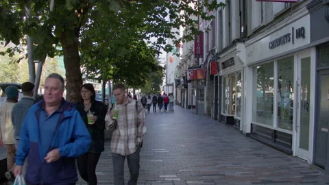 The citizens of Cork are walking along the streets of the city on an autumn Stock Footage 232621180
