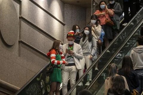 Citizens wearing the face masks on the street Stock Photos