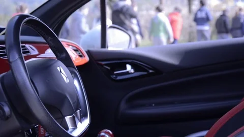 Citroen DS3 interior view with school boys on the ground Stock Footage 84091438