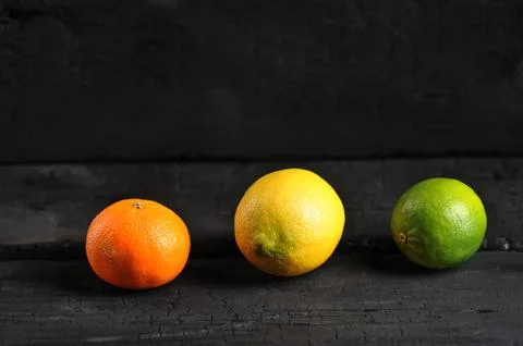 Citrus on a black background Stock Photos