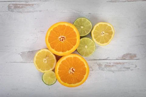 Citrus flat lay background oranges limes and lemons Stock Photos