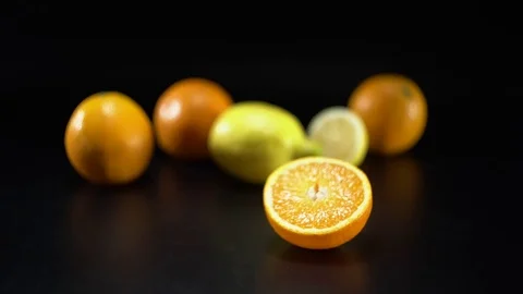 Citrus fruit on black background, panning, shallow Depth of field 스톡 동영상 75825916