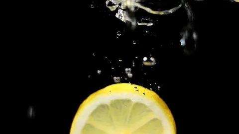Citrus fruit falling into the water Video stock 75870428