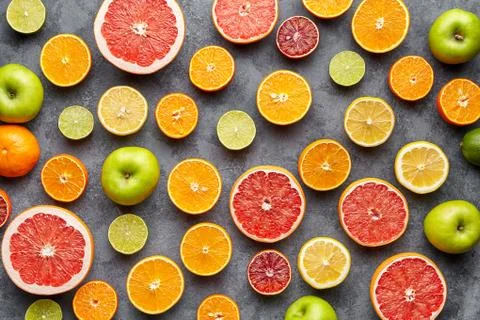Citrus fruit pattern on grey concrete table. Fruit food background. Healthy Stock Photos