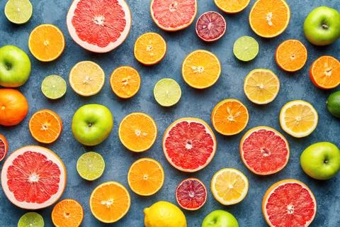 Citrus fruit pattern on grey concrete table. Food background. Healthy eating Stock Photos