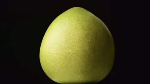 Citrus fruit Pomelo on black background. Stock Footage 325988405