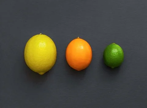 Citrus fruit on a stone table. Stock Photos