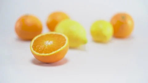 Citrus fruit on white background, panning, shallow Depth of field Video stock 75819616