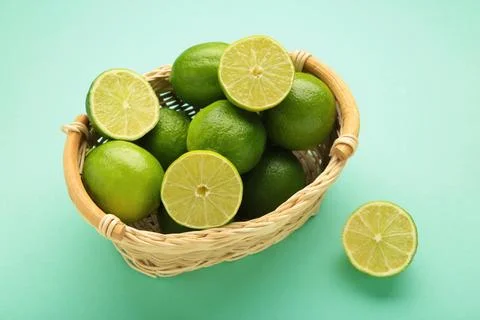 Citrus lime fruit on mint background cutout Stock Photos