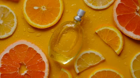 Citrus perfume on a yellow background. Selective focus. Stock Footage 219454952