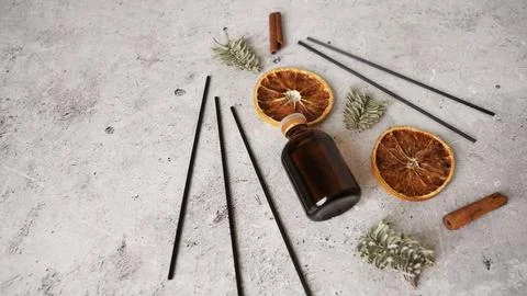 Citrus reed diffuser with cinnamon, dry orange and fir tree branches. Stock Photos