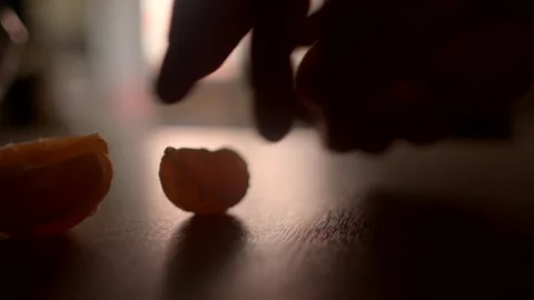 Citrus segments artfully arranged on a table, with a softly lit background addin Stock Footage 297202120