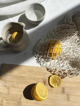 Citrus Still Life Composition Featuring Fresh Lemons and Earthy Textures fo.. Stock Photos