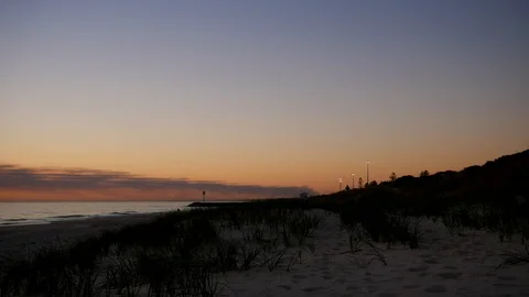 City Beach at sunset time-lapse smoke in distance Stock Footage 112336466