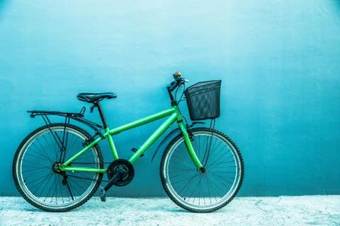 City bicycle on the grey backgound wall Stock Photos